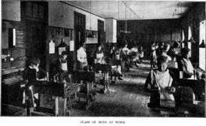 This image from Gustaf Larsson's sloyd textbook shows a class of young boys at their workbenches. At Mrs. Shaw's School, boys and girls learned sloyd together.