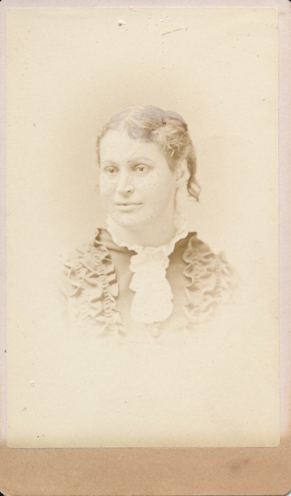 Photograph of Sissy R. Drake, taken at the studio of Metcalf and Welldon in Boston, MA. Hers is the 20th photograph in Charles Nichols' photograph album.